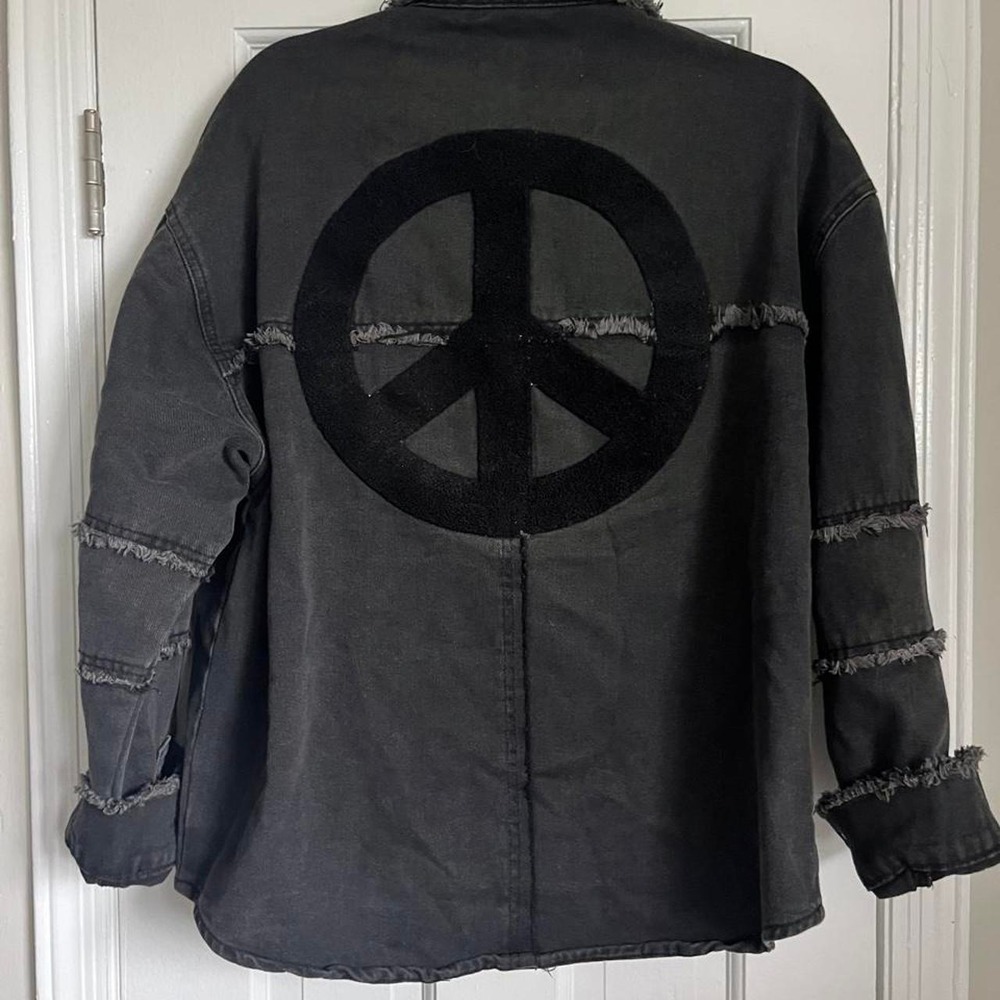 Black denim jacket with peace sign on the back, size M